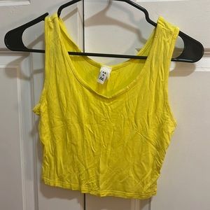 Yellow tank top crop top.